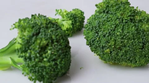Shift focus on fresh ripe broccoli. Slow motion Stock Footage 147673630