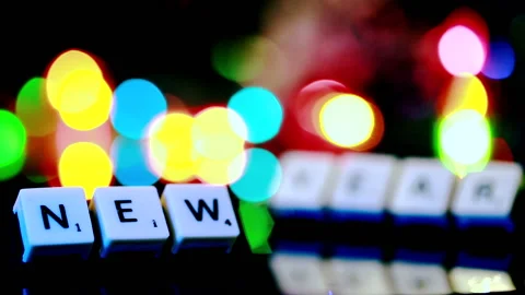 Shift focus on “new year” letters with bokeh, blinking lights background. Stock Footage 145524957