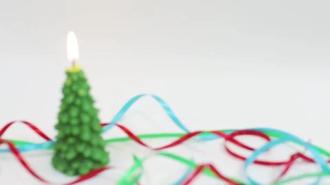 Shift from focused to blurred burning candle in shape of fir tree Stock Footage 143660205