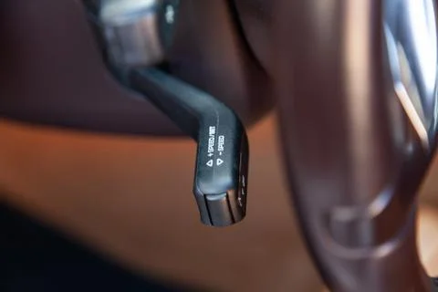 The shift lever to set the automatic cruise control speed inside the car clos Stock Photos