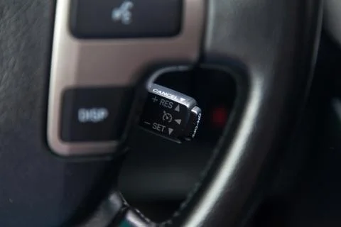 The shift lever to set the automatic cruise control speed inside the car clos Stock Photos