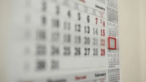 Shift red mark frame on the date on wall calendar Stock Footage 70961872