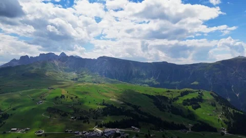 Shifting clouds gliding over a lush green valley Video stock 283290793