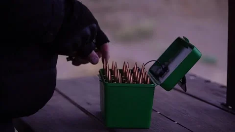 Shifting live ammunition in a box close-up Stock Footage 228053126