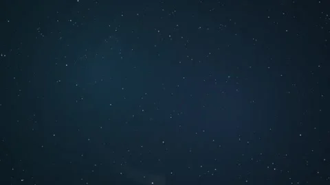 Shifting moonlight illuminates a vast, starry night sky Video stock 327625937