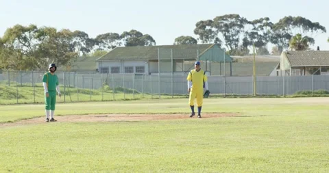 Shifting weight on mound at community field, male baseball player stepping off Stock Footage 336783773