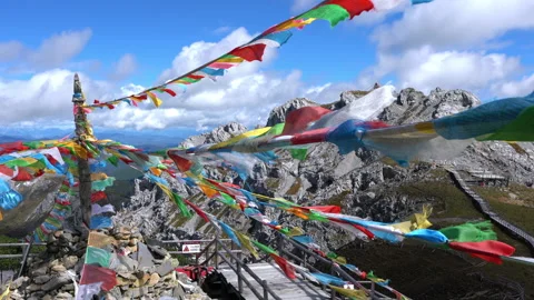 Shika mountain summit view and prayer flags in Shangri-La Yunnan China Stock Footage 149018620