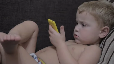 Сhild with a Smartphone hands Video stock 42369235
