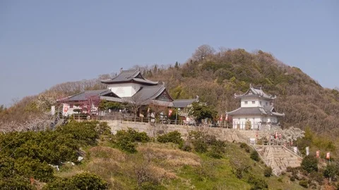 Shimanami Castle while camera smoothly decending a path Stock-Footage 92599061