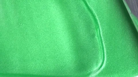 Shimmer green texture close-up on a white background. Metal spatula smears .. Video stock 271239217