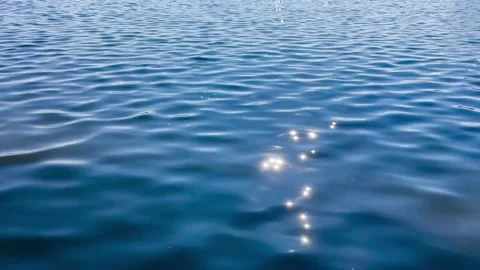 The shimmering blue lake surface, smooth, little wave Video stock 270322871