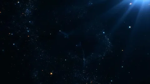 Shimmering blue particles creating a sparkling dust with light rays shining from Stock Footage 314905797