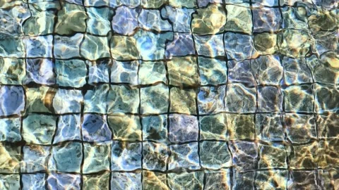 Shimmering Blue Pool Water with Sunlight Caustic Patterns Stock Footage 337698573
