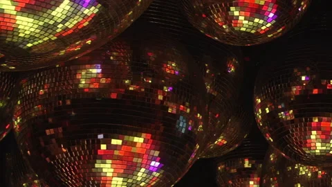 Shimmering Disco Spheres Reflect Dazzling Club Lights at Night Stock Footage 334927546