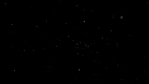 Shimmering dust particles float in the air. A dark cinematic background with Stock Footage 326779577