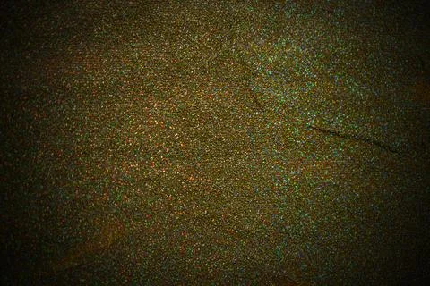 Shimmering festive glitter surface, uniform texture, metallic iridescent colo Stock Photos