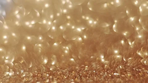Shimmering gold bokeh in slow motion, with dreamy, shifting focus for Christmas. Stock Footage 291891787