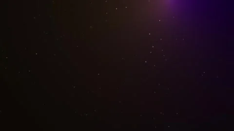 Shimmering golden particles floating in dark space with subtle purple light leak Stock-Footage 340459277