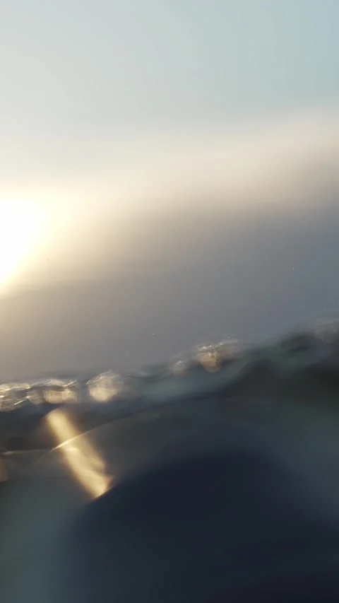 Shimmering Light on Underwater Waves at Dawn Stock Footage 335197659