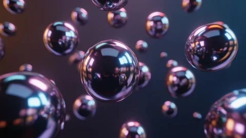 Shimmering metallic spheres float in dark gradient background 库存影片 337874397