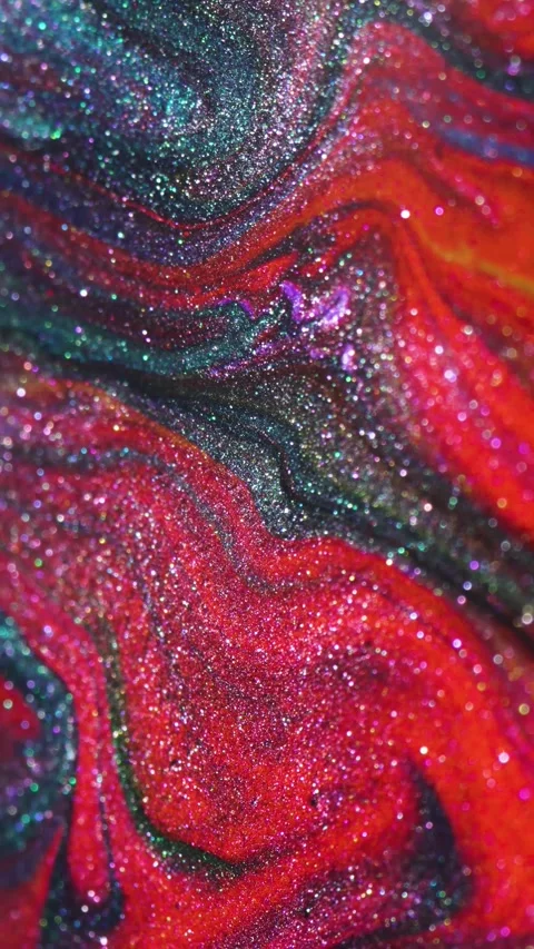 A shimmering, multi-colored abstract background with iridescent swirls created 스톡 동영상 336101406