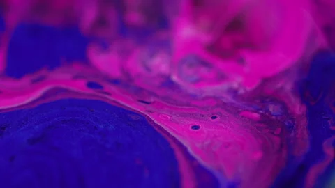 Shimmering paint neon fluid blend pink blue ink Stock Footage 266763633