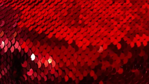 Shimmering Red Sequins Fabric with Gradient Lighting Abstract Texture Background Stock Footage 330520231