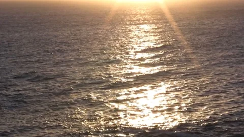 Shimmering sea at sunset Stock Footage 93190693
