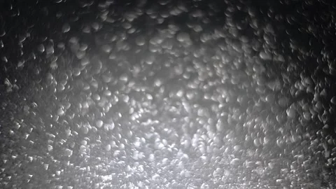 Shimmering silver bokeh, shifting focus in slow-motion, perfect for festive Stock Footage 291890177