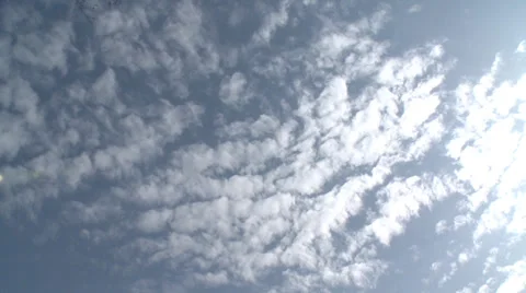 Shimmering silver cloud with brilliant blue sky shining thro' Stock Footage 38482792