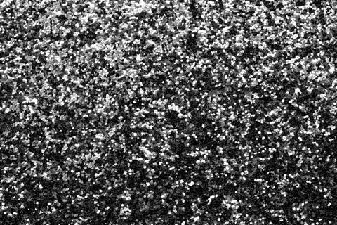 Shimmering Silver glitter material background with gray sparkles Photos
