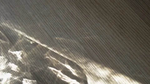 Shimmering sun reflections on wooden surface Stock Footage 333980420