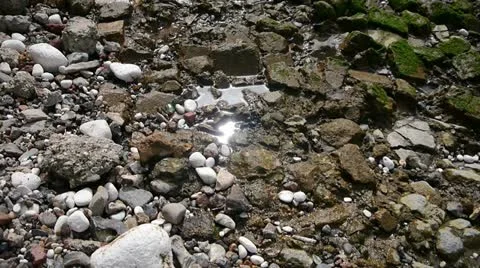 Shimmering sunlight on pool between rocks. Stock Footage 11282471