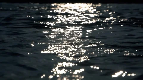 Shimmering Sunlight Reflections On Dark Ocean Surface With Gentle Ripples Stock Footage 337406115