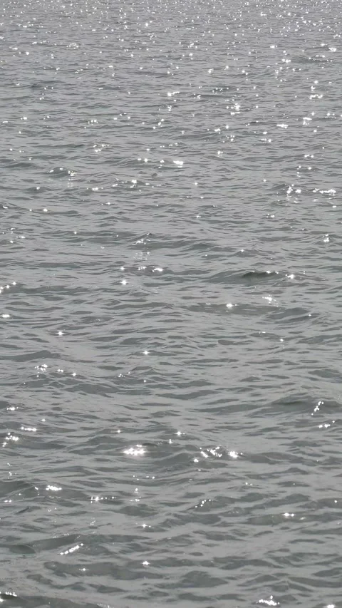 Shimmering water glittering river texture with sunlight 4k video Stock Footage 295928861