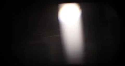 Shimmery light leaks on black background. Lens flare burst overlays with bokeh Stock Footage 168550631