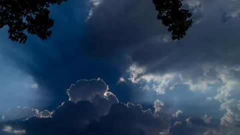 Shining behind the clouds Stock Photos