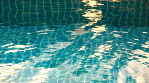 Shining blue water ripple in pool at sunset time. Video shift motion Stock Footage 39732194