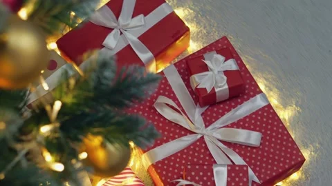 The shining Christmas tree, dressed in a festive outfit, creates the impression Stock Footage 247472188