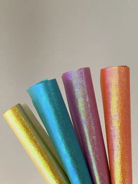 Shining colored paper in scroll, abstract background Stock-Fotos