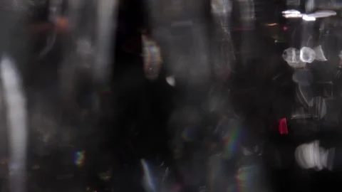 Shining crystal lights move in the darkness. 库存影片 318586892
