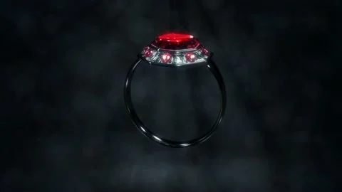 Shining dark metal ring with red ruby gem stone rotate, fictitious Stock Footage 184608550
