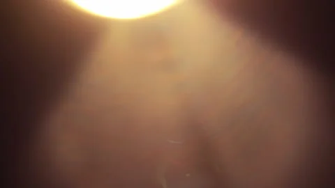 Shining flashlight lens flare light leak overlay with black background Stock Footage 287068420