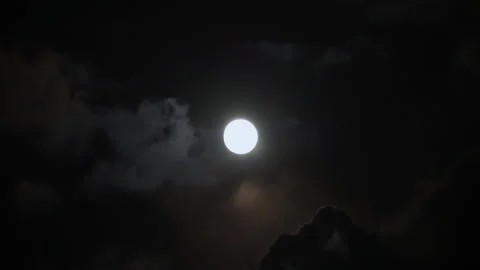 Shining full moon on a cloudy sky at dark night time. Stock Footage 281315395