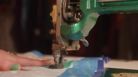 Shining Green Sewing Machine Knitting Colorful Fabric in Slow Motion Stock Footage 300342415