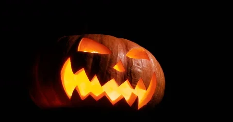 Shining Jack-O-Lantern. Halloween pumpkin with scary face smoke inside with Stock Footage