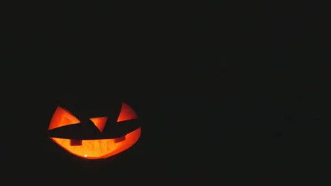 Shining Jack-O-Lantern. Halloween pumpkin with scary face. copy space Stock Footage 118218635