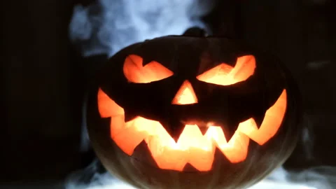Shining Jack-O-Lantern. Halloween pumpkin with scary face. Video stock 118548364