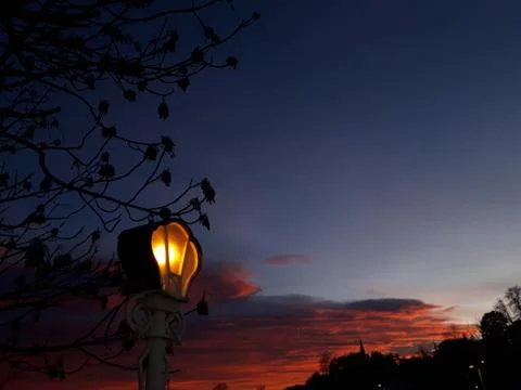 A shining lantern on a sunset background Stock Photos