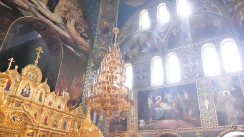 Shining light rays in orthodox christian church interior Stock Footage 273687117
